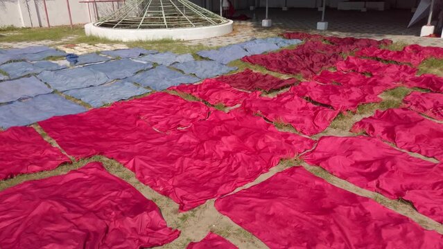 A laundry project in Kerala, India. Drying tablecloths