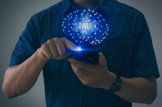 business man using a smartphone turn on brain intelligence AI technology.Internet of Things IoT, big data, 4.0 industrial technology. 