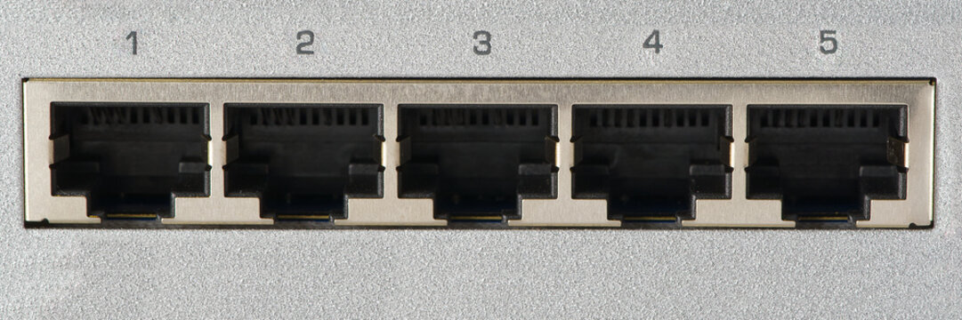 Small router and switch. tcp ip network business concept. High - performance gigabit switch. home network gray switch.