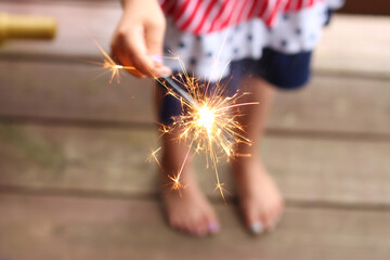 sparkler held by child