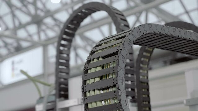 Flexible electric cable chains combine wires into a movable element for the operation of industrial equipment