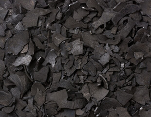 coconut shell charcoal, carbonized raw coconut shells in a limited supply of air, widely used in domestic and industrial fuel, create activated carbon, organic fertilizer, background taken from above - obrazy, fototapety, plakaty