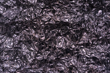 Abstract texture pattern metallic paper using as a background or wallpaper. Metal aluminum foil...