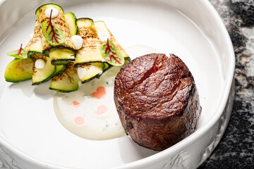 steak with grilled vegetables and sauce