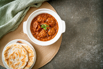 chicken tikka masala spicy curry meat food with roti or naan bread