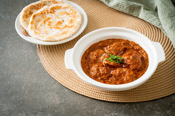 chicken tikka masala spicy curry meat food with roti or naan bread