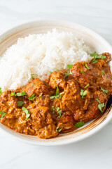 chicken tikka masala with rice on plate