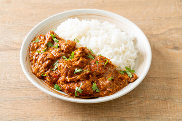 chicken tikka masala with rice on plate
