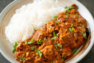 chicken tikka masala with rice on plate