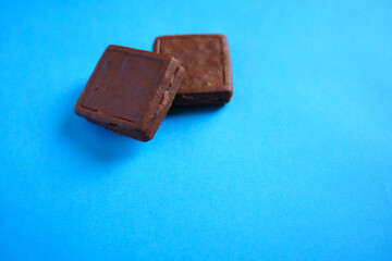Chocolate cookies on blue background.