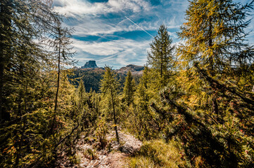 Mountain climber on a steep and exposed Via Ferrata Col dei Bos near passo falzarego. Autumn Passo...