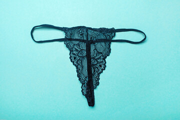 Beautiful black lace panties - thongs. Black lace lingerie. - obrazy, fototapety, plakaty