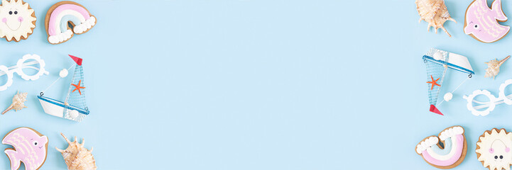 Bright summer banner. Cute summer symbols on blue background. Top view, Flat lay. Copy space. Creative summer concept