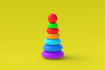 Pyramid toy on yellow background. Children education. Educational games. Preschool development. 3d render