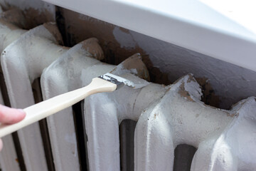 Painting radiators with a special brush