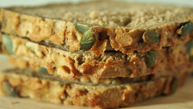 bread with pumpkin seeds on a white background. Pumpkin bread.