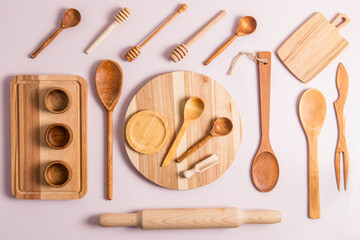 top view of a set of different wooden and bamboo kitchen utensils. flat layout. eco-friendly...
