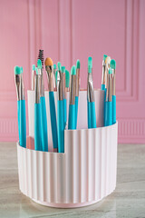 makeup products pink background