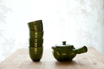 chinese tea set on table. Studio green tea elements or healthy background.japanese green tea cups