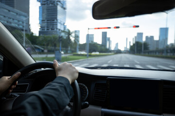 People driving car on city road