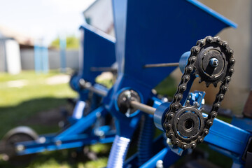 Close-up of a blue seeder for agricultural machinery