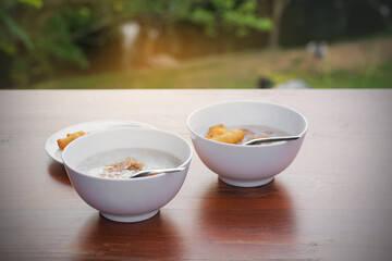 Two boiled rice on wood table with natural background,hot rice ,Asian food style.