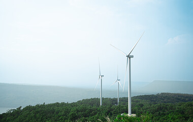 Wind Turbines Windmill Energy Farm.Sustainability Electrical generator renewable background.Hill and sky landscape wind mill ecological green concept.Reduce global warming.