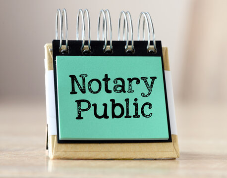 The words NOTARY PUBLIC in a notebook on a light background.