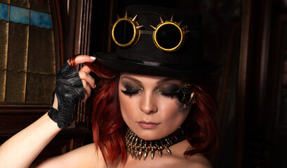 Steampunk girl hat with deep neckline, round glasses portrait