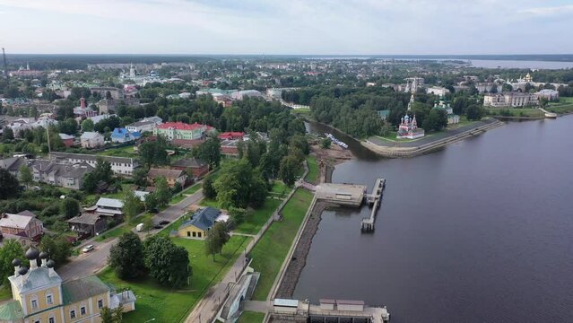 Summer aerial view of modern Uglich cityscape overlooking architectural complex of Kremlin with Transfiguration Cathedral and Church of Dimitry Tsarevich on bank of Volga, Russia