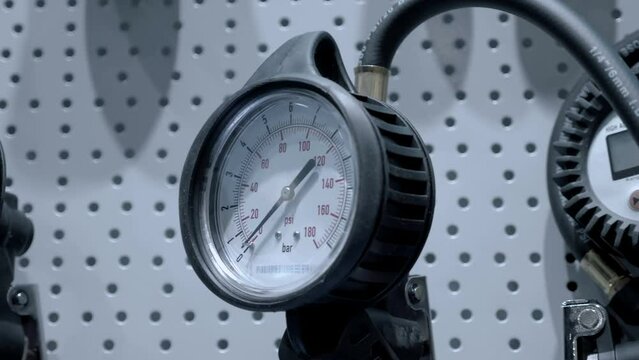 New analog pressure gauge for accurate pressure measurement. Closeup. Shot in motion