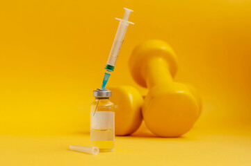 syringe is stuck in a jar, there are dumbbells on a yellow background next to it. the concept of doping in sports, steroids, testosterone and other drugs prohibited in sports. - obrazy, fototapety, plakaty