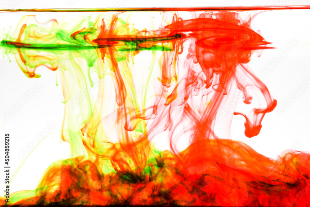 Poster abstract soft focus red and green color ink floating in water for backdrop use.