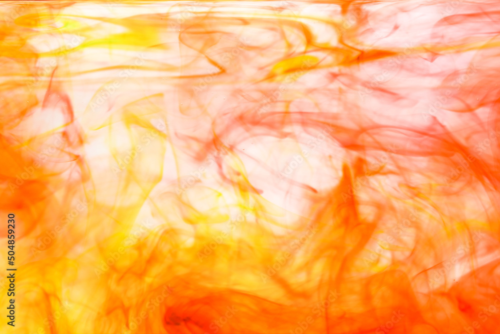 Poster abstract soft focus orange color ink floating in water for backdrop use.