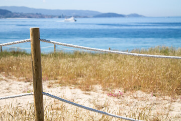 wooden walkway with beach in the background. holiday landscape