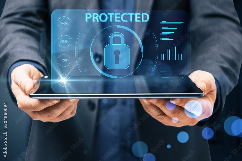 Poster Protection and internet security concept with digital lock sign and indicators projected above digital table in man hands