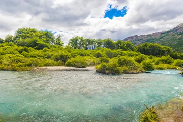 Tuinposter Turquoise river under the Andes mountains © Fyle