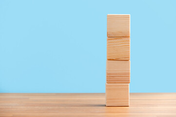 Blank wooden block cubes on a blue background for your text. free space for business concept template and banner..