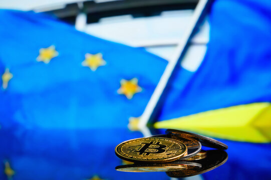 Bitcoins on the background of the flag European Union and Ukraine. Concept for investors in cryptocurrency and blockchain technology in the European Union and Ukraine