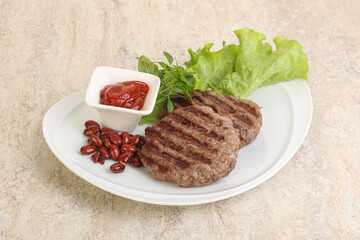 Grilled beef burger cutlet with sauce