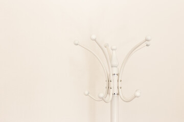Floor hanger for white clothes on a white background