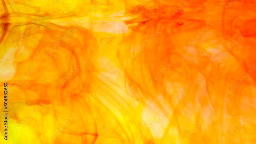 Poster abstract soft focus orange color ink floating in water for backdrop use.