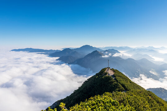 Germany, Bavaria, Peak Of Herzogstand Mountain With Thick Fog In Background