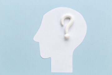 Question mark sign with paper human head. FAQ and help concept