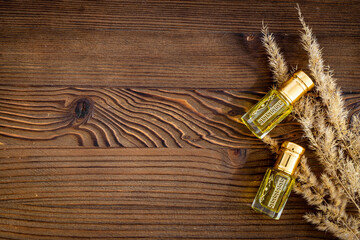 Perfume essential oil in glass bottles, top view. Traditional Arabian fragrance