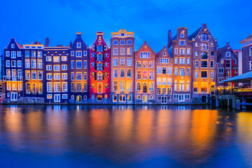 Amsterdam, Netherlands. Colorful houses at the Damrak canal.