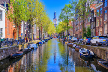 Amsterdam, Netherlands. Groenburgwal canal with Zuiderkerk tower in the background.