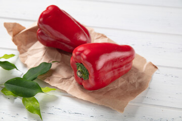 Group of fresh red peppers on an old vintage wooden table, catalog photography