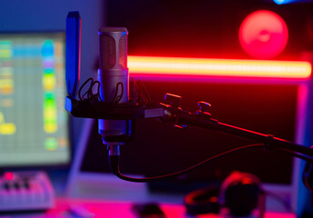 Studio microphone in a recording studio with neon light. High quality photo