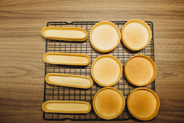 dough in a baking tart form and rolling pin